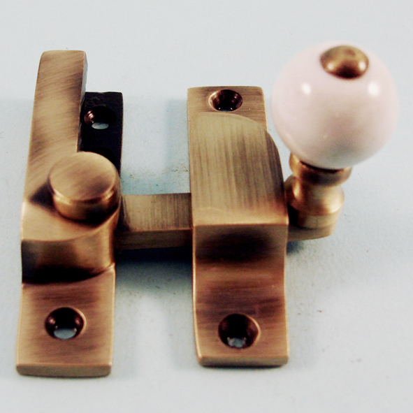 THD104N/AB • Non-Locking • Antique Brass • Narrow Straight Arm Ceramic Knob Sash Fastener
